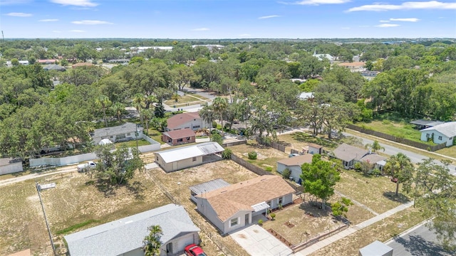 105 E Magnolia St, Davenport, FL 33837 - aerial perspective of suburban area featuring a tree filled landscape