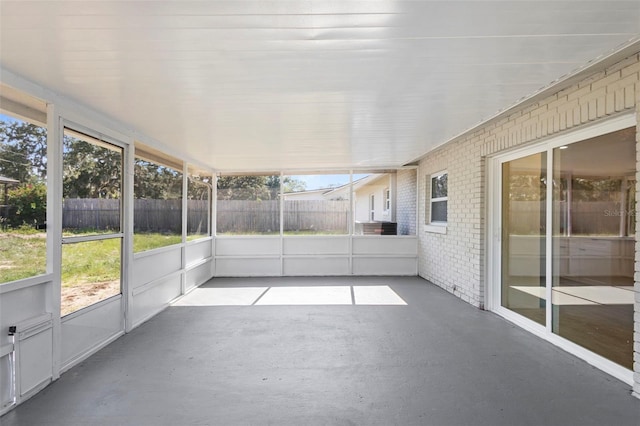 105 E Magnolia St, Davenport, FL 33837 - unfurnished sunroom with healthy amount of natural light
