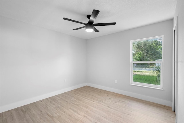 105 E Magnolia St, Davenport, FL 33837 - empty room with wood finished floors and ceiling fan