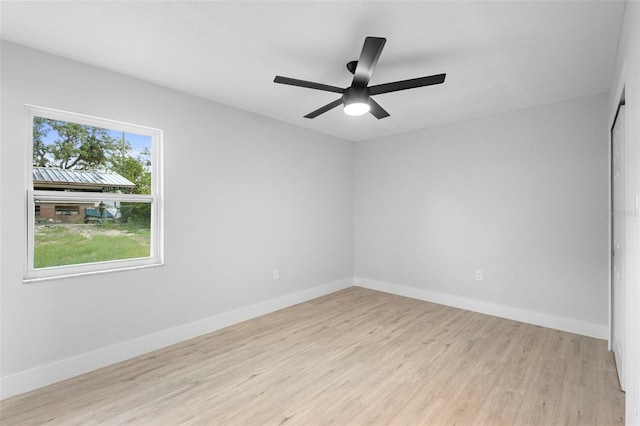 105 E Magnolia St, Davenport, FL 33837 - unfurnished room with light wood finished floors and a ceiling fan
