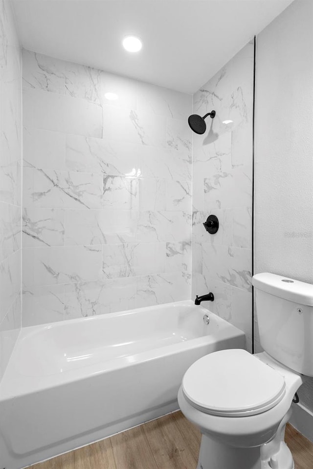 105 E Magnolia St, Davenport, FL 33837 - full bathroom with wood finished floors and washtub / shower combination