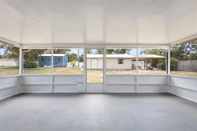 105 E Magnolia St, Davenport, FL 33837 - unfurnished sunroom with plenty of natural light