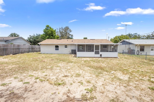 105 E Magnolia St, Davenport, FL 33837 - back of property featuring a sunroom and a fenced backyard