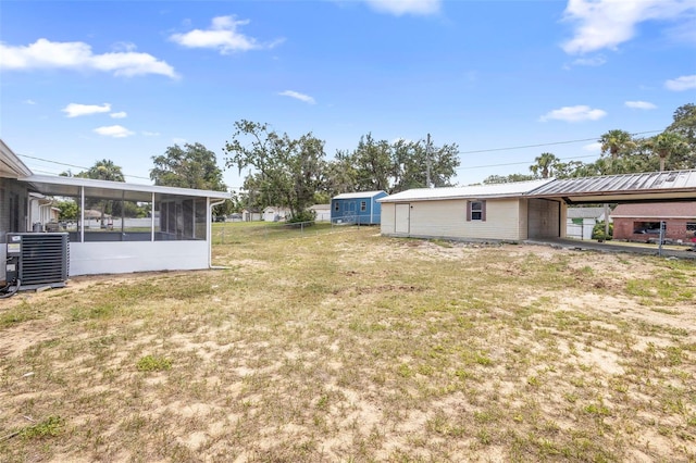 105 E Magnolia St, Davenport, FL 33837 - view of yard with a sunroom and an attached carport