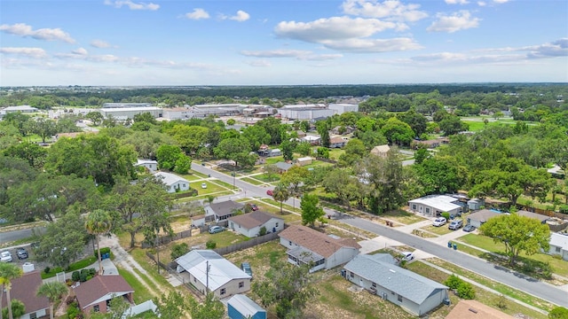 105 E Magnolia St, Davenport, FL 33837 - aerial perspective of suburban area featuring a tree filled landscape
