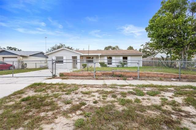 105 E Magnolia St, Davenport, FL 33837 - ranch-style house with a fenced front yard, a gate, and driveway