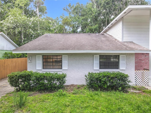 809 Sugar House Blvd, Port Orange, FL 32129 - view of front of property with a shingled roof and stucco siding