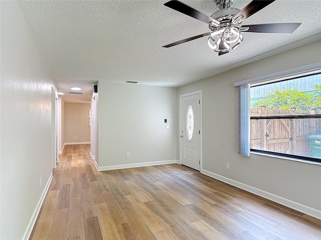 809 Sugar House Blvd, Port Orange, FL 32129 - entryway with light wood finished floors, a textured ceiling, and a ceiling fan