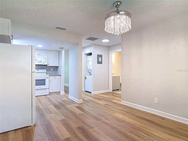 809 Sugar House Blvd, Port Orange, FL 32129 - kitchen with white appliances, white cabinetry, light wood-style flooring, a chandelier, and recessed lighting
