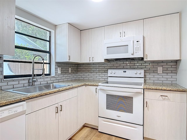 809 Sugar House Blvd, Port Orange, FL 32129 - kitchen with white appliances, decorative backsplash, light stone counters, and light wood-style floors
