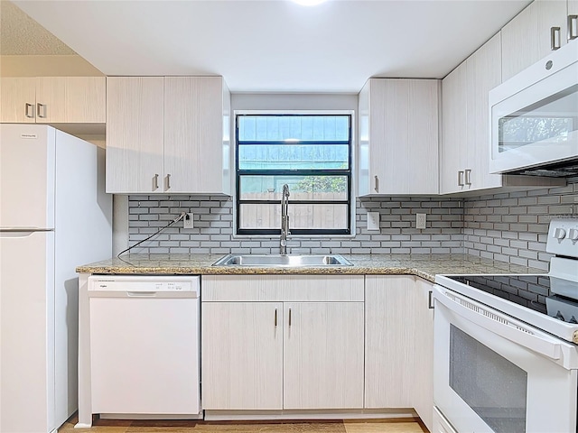 809 Sugar House Blvd, Port Orange, FL 32129 - kitchen with white appliances, backsplash, and light stone countertops