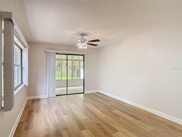 809 Sugar House Blvd, Port Orange, FL 32129 - empty room featuring light wood-type flooring, ceiling fan, and a textured ceiling