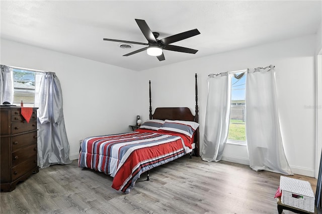 2908 Clear Way, Orlando, FL 32805 - bedroom with wood finished floors and a ceiling fan