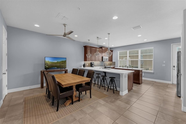 8968 Hildreth Ave, Orlando, FL 32832 - dining room with recessed lighting, a ceiling fan, and light tile patterned floors