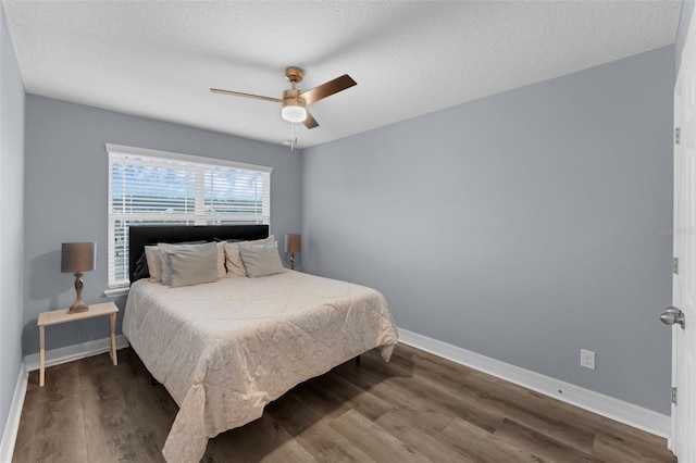 8968 Hildreth Ave, Orlando, FL 32832 - bedroom featuring wood finished floors, a ceiling fan, and a textured ceiling