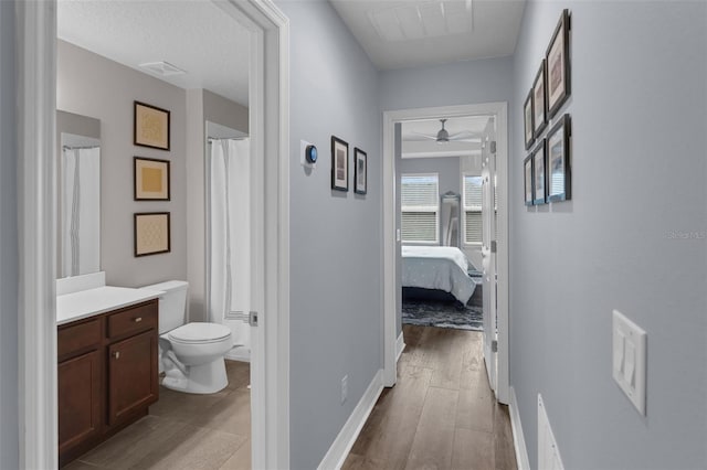 8968 Hildreth Ave, Orlando, FL 32832 - hallway with wood finished floors and baseboards