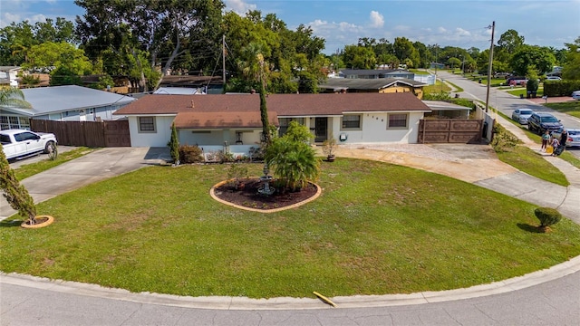 1105 Arrowsmith Ave, Orlando, FL 32809 - view of front of house with concrete driveway, stucco siding, roof with shingles, and a residential view