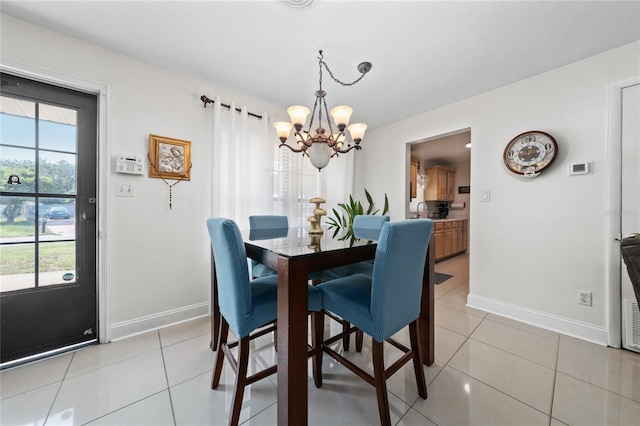 1105 Arrowsmith Ave, Orlando, FL 32809 - dining space featuring a chandelier and light tile patterned floors