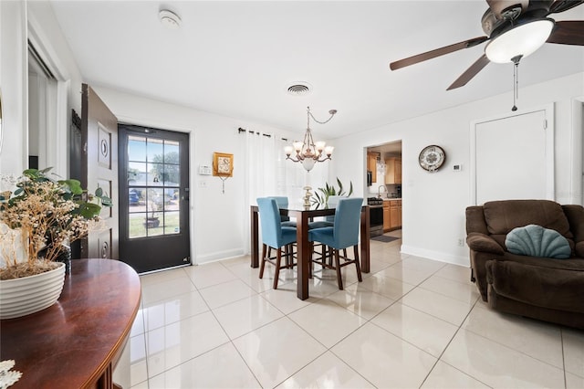 1105 Arrowsmith Ave, Orlando, FL 32809 - dining room featuring a chandelier, light tile patterned flooring, and a ceiling fan