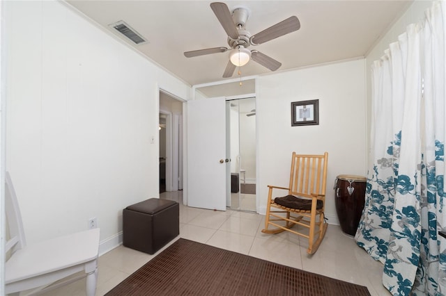 1105 Arrowsmith Ave, Orlando, FL 32809 - living area featuring light tile patterned flooring and ceiling fan