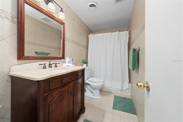 1105 Arrowsmith Ave, Orlando, FL 32809 - bathroom featuring vanity, tile walls, and tile patterned floors