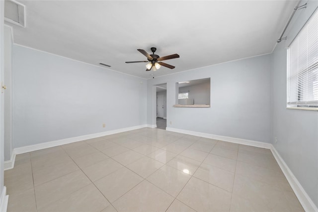 1105 Arrowsmith Ave, Orlando, FL 32809 - tiled spare room with a ceiling fan and healthy amount of natural light