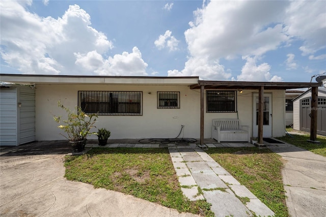 1105 Arrowsmith Ave, Orlando, FL 32809 - view of front of property featuring stucco siding and covered porch