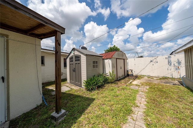 1105 Arrowsmith Ave, Orlando, FL 32809 - view of yard featuring a storage shed