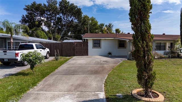 1105 Arrowsmith Ave, Orlando, FL 32809 - single story home featuring concrete driveway, stucco siding, and a gate