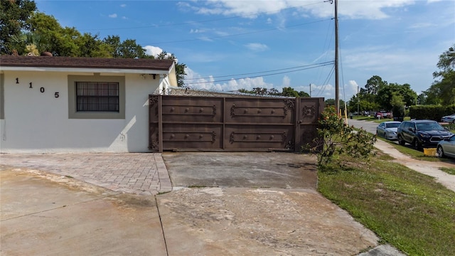 1105 Arrowsmith Ave, Orlando, FL 32809 - view of home's exterior with stucco siding