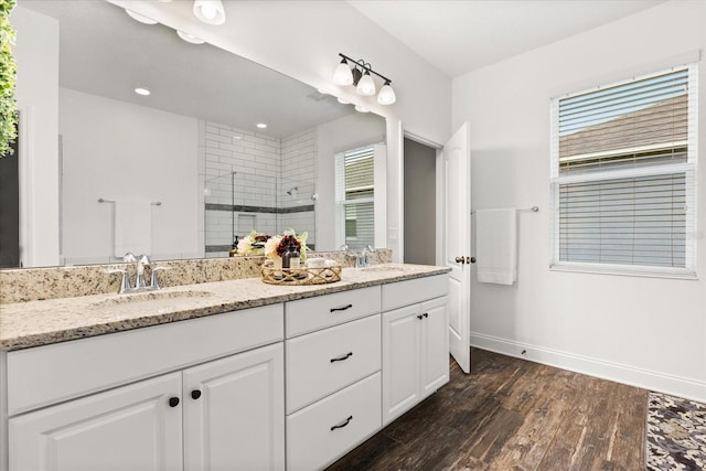 31924 Geoff, Sorrento, FL 32776 - full bath with double vanity, a shower stall, wood finished floors, healthy amount of natural light, and recessed lighting