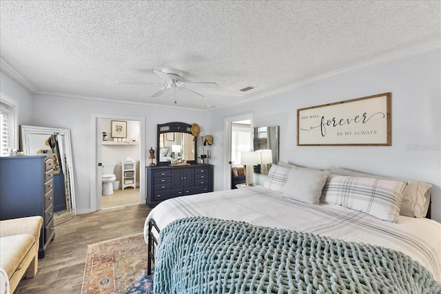 2356 Date Palm Dr, Edgewater, FL 32141 - bedroom with wood finished floors, ornamental molding, a textured ceiling, a ceiling fan, and ensuite bathroom