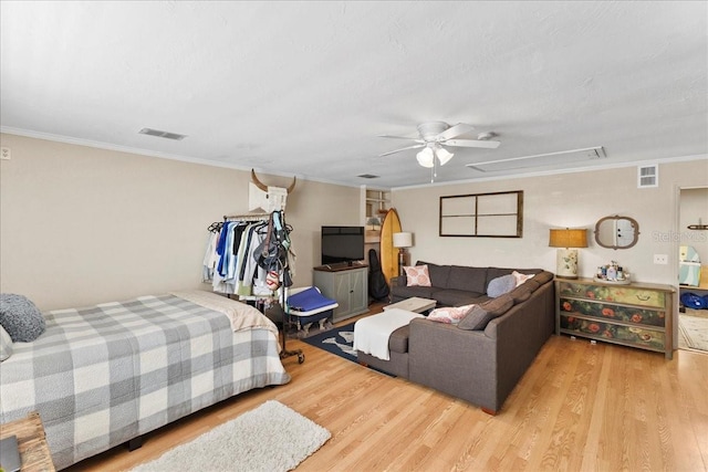 2356 Date Palm Dr, Edgewater, FL 32141 - bedroom with wood finished floors, attic access, crown molding, and a ceiling fan