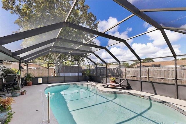 2356 Date Palm Dr, Edgewater, FL 32141 - view of swimming pool with a fenced backyard, a patio area, and glass enclosure
