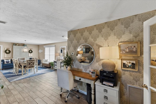 2356 Date Palm Dr, Edgewater, FL 32141 - office featuring wallpapered walls, a textured ceiling, and wood finished floors