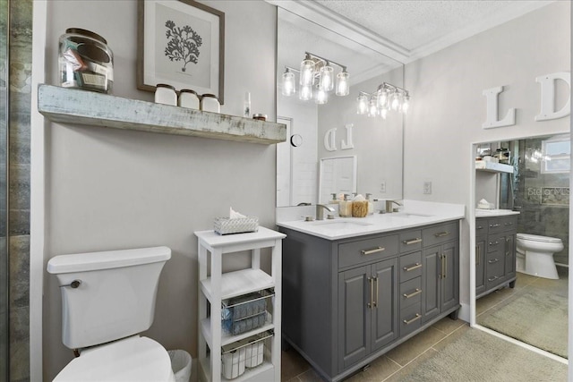 2356 Date Palm Dr, Edgewater, FL 32141 - bathroom with double vanity, tile patterned flooring, ornamental molding, a textured ceiling, and a tile shower
