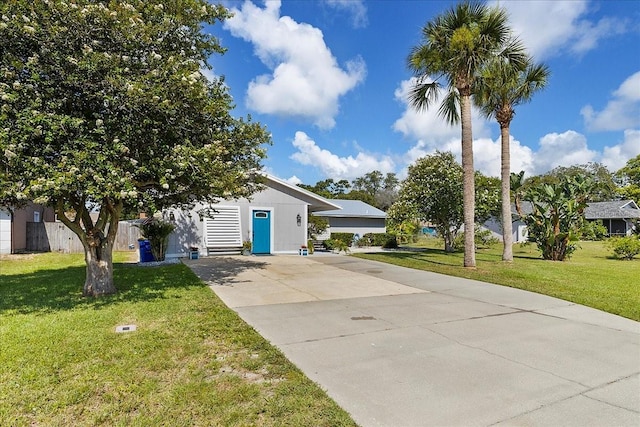 2356 Date Palm Dr, Edgewater, FL 32141 - view of front of house featuring driveway and a front lawn