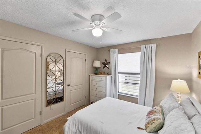 2356 Date Palm Dr, Edgewater, FL 32141 - carpeted bedroom with a textured ceiling and a ceiling fan