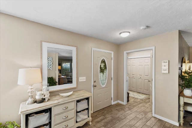 2356 Date Palm Dr, Edgewater, FL 32141 - foyer with light wood-style floors and baseboards