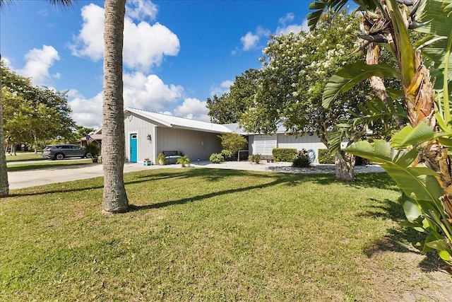 2356 Date Palm Dr, Edgewater, FL 32141 - view of front facade featuring a front yard and concrete driveway
