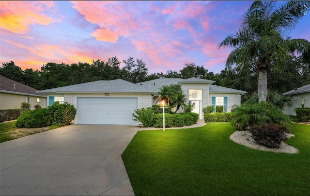 20542 Queen Alexandra Dr, Leesburg, FL 34748 - single story home with an attached garage, driveway, and a lawn