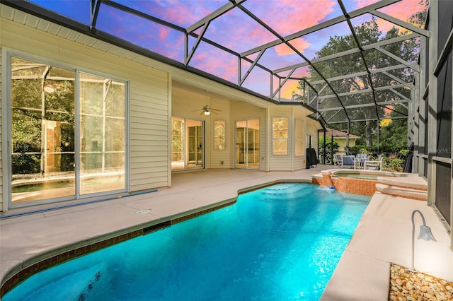 20542 Queen Alexandra Dr, Leesburg, FL 34748 - view of swimming pool with a patio area, a ceiling fan, a pool with connected hot tub, and glass enclosure
