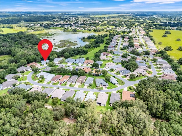 20542 Queen Alexandra Dr, Leesburg, FL 34748 - aerial overview of property's location featuring a nearby body of water and nearby suburban area