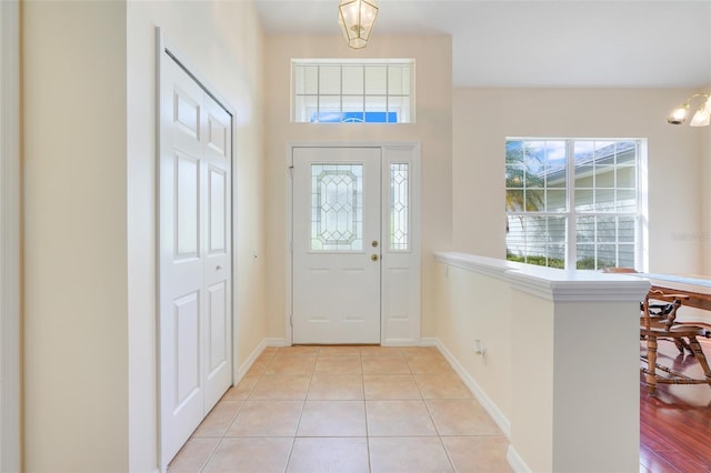 20542 Queen Alexandra Dr, Leesburg, FL 34748 - foyer entrance featuring light tile patterned flooring and baseboards