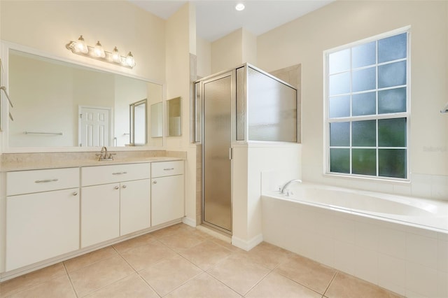 20542 Queen Alexandra Dr, Leesburg, FL 34748 - bathroom featuring vanity, a bath, a shower stall, and healthy amount of natural light