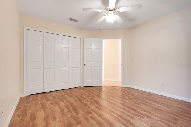20542 Queen Alexandra Dr, Leesburg, FL 34748 - unfurnished bedroom featuring light wood-type flooring, a closet, and a ceiling fan