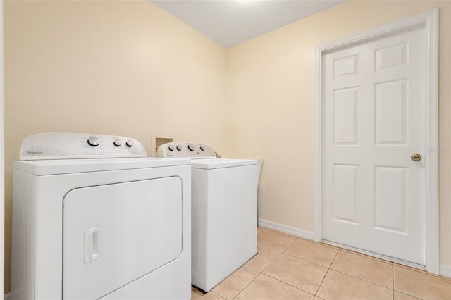 20542 Queen Alexandra Dr, Leesburg, FL 34748 - laundry area with independent washer and dryer and light tile patterned floors