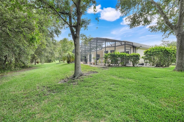 20542 Queen Alexandra Dr, Leesburg, FL 34748 - view of grassy yard featuring a lanai
