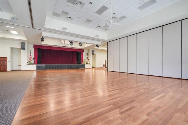 20542 Queen Alexandra Dr, Leesburg, FL 34748 - unfurnished living room with wood finished floors, ceiling fan, a raised ceiling, and a drop ceiling