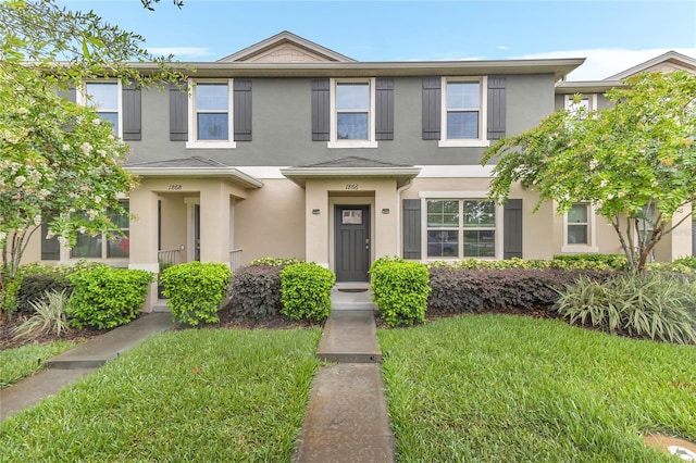 1866 Red Canyon Dr, Kissimmee, FL 34744 - multi unit property featuring stucco siding and a front yard